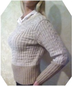 A photo of a handmade knitted sweater, color milk-and-coffee, side view, pattern and model author- Tai Keri, sku 1-17, Wool