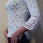 A photo of a handmade crochet blouse, sleeves with the ornaments. Cotton 100%, color white, sku 1-8, Author- Tai Keri