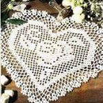 A photo of a misc 19th, heart form napkin crochet