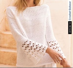A photo of the 57th sweater, knitted, sleeves at the edges - crochet